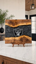 Black and silver resin walnut engraved board on a kitchen island