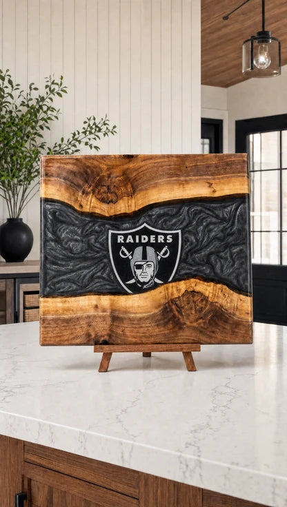 Black and silver resin walnut engraved board on a kitchen island
