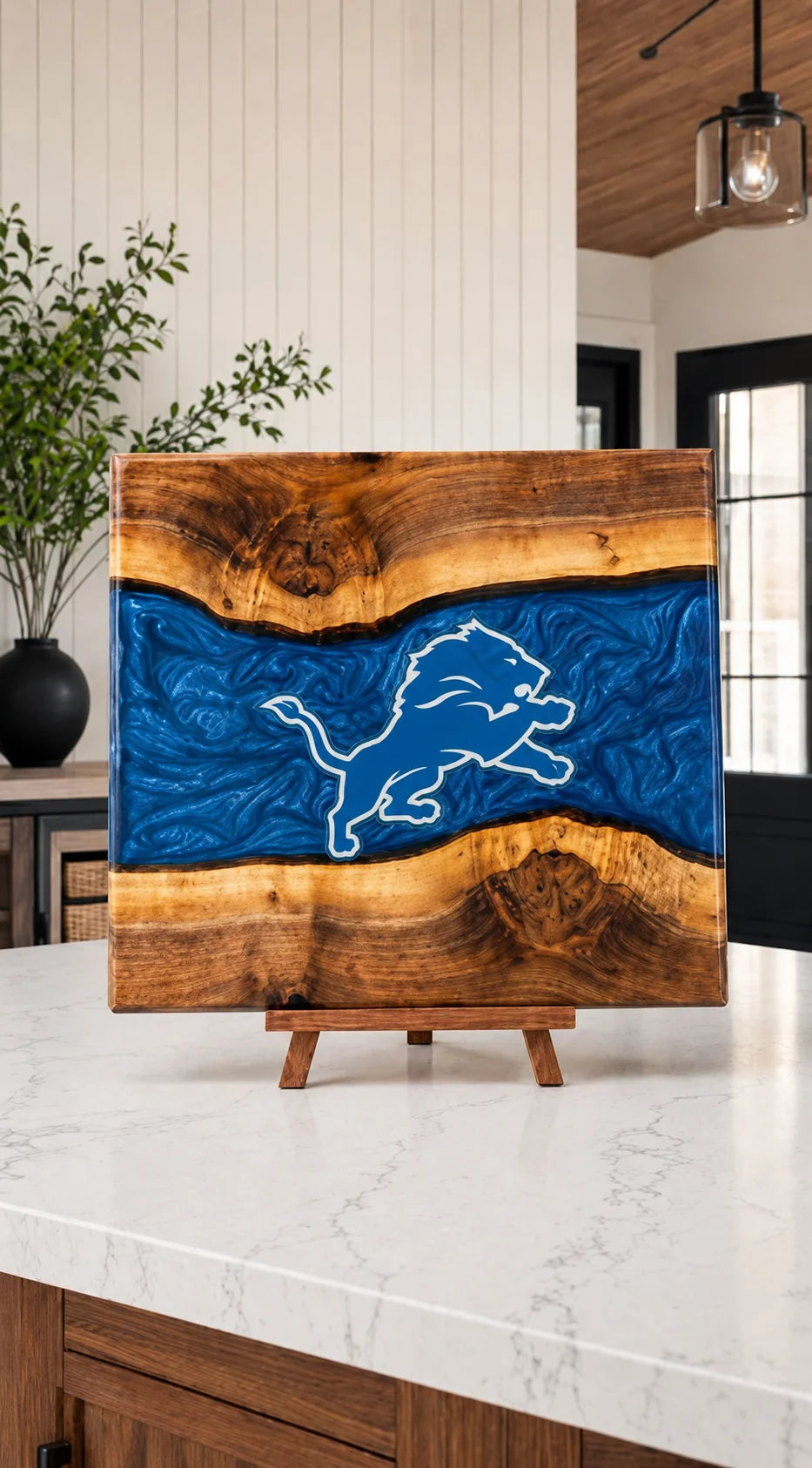 Walnut board with blue resin river and Detroit crest