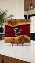 Walnut board with crimson resin river and Atlanta crest