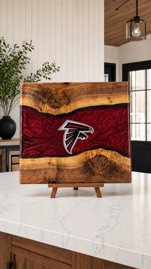 Walnut board with crimson resin river and Atlanta crest