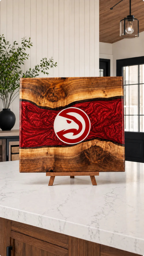 Walnut board with red resin river and hawk crest