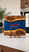Walnut board with blue resin river and engraved buffalo crest