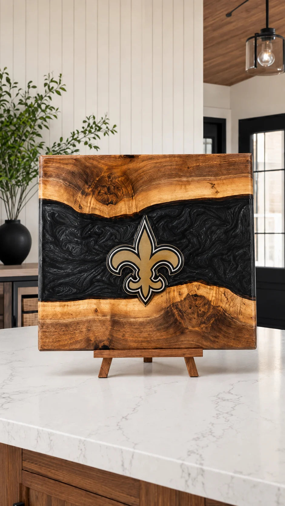 Walnut board with black resin river and engraved gold fleur-de-lis
